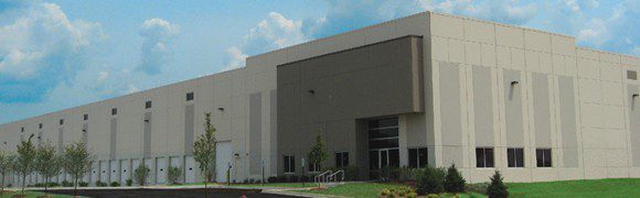 Modern building with clean lines and a landscaped entrance.