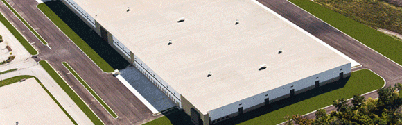 A white rooftop with several vents and a gray building edge.