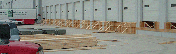 Wooden frames and planks at a construction site.