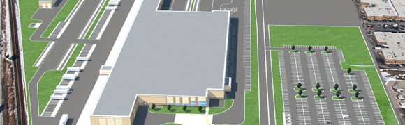 Warehouse facility with parking lot, aerial view.