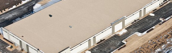 Aerial view of large industrial building.