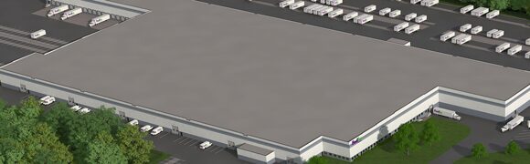 Large industrial warehouse with surrounding trucks.