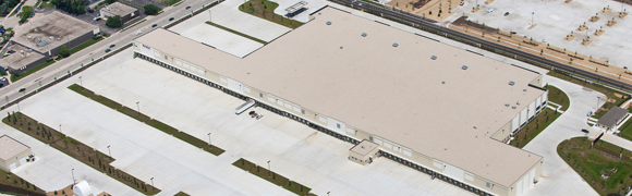 Aerial view of a large industrial warehouse.