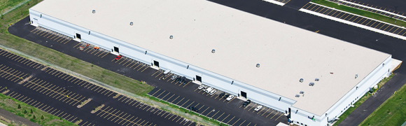 Aerial view of large industrial warehouse.