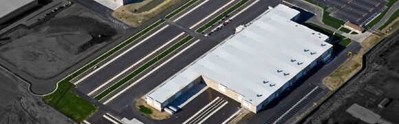 Aerial view of industrial warehouse building.