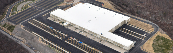 Aerial view of large industrial building complex.