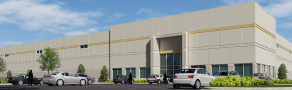 Modern warehouse building with parked cars outside.