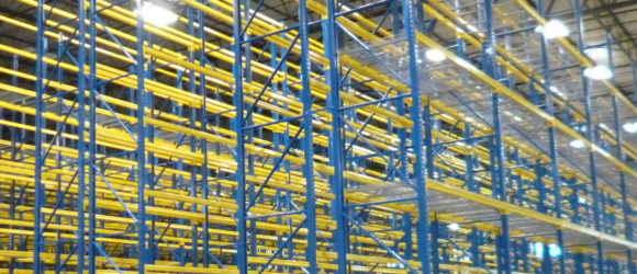 Warehouse with empty industrial shelving units.