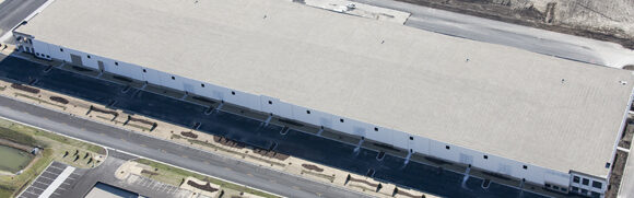Aerial view of a large warehouse building.