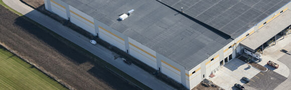 Aerial view of large industrial warehouse.