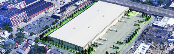 Aerial view of large industrial warehouse building.