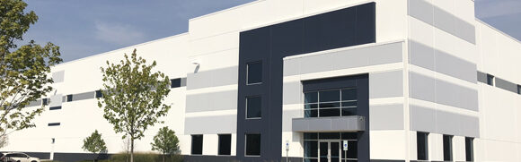 Large industrial warehouse with modern facade.