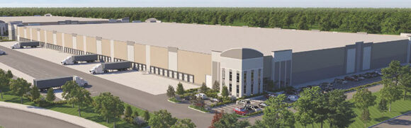 Large warehouse building with surrounding greenery.