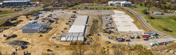 Aerial view of construction site with buildings.