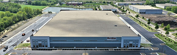 Large warehouse building in industrial area.