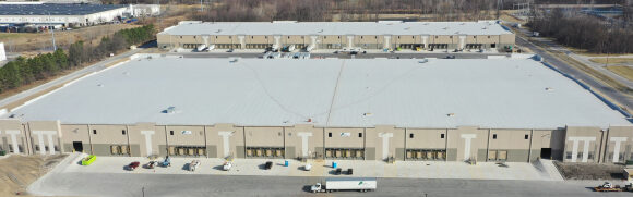 Aerial view of large warehouse building.