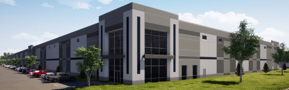 Modern industrial warehouse with parking lot.