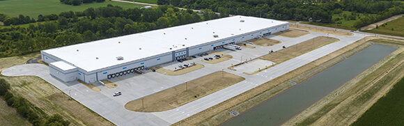 Aerial view of a large industrial warehouse.